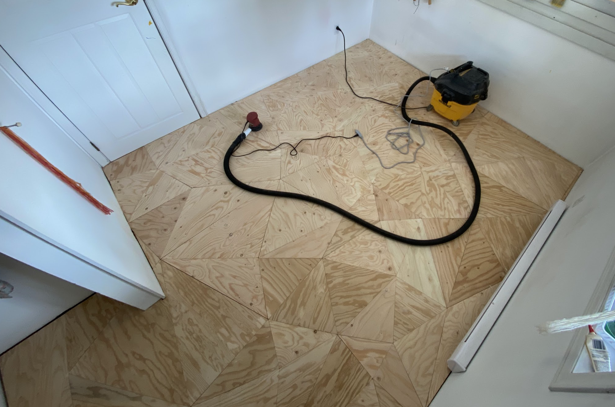 Plywood triangle floor for Jess’ art studio